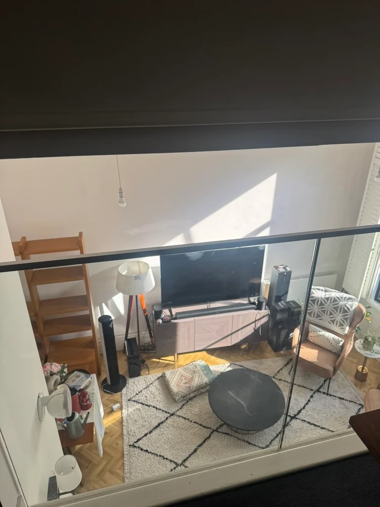Apartment living room seen from the mezzanine before a move