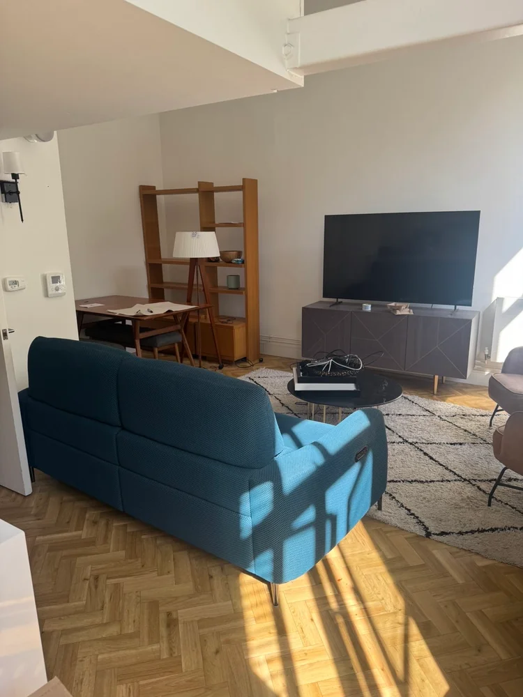 Living room furniture arranged in place after a move