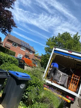 SJC Movers van with the tail lift down during a house move