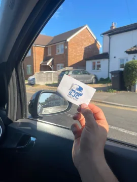 SJC Movers contact card handed to a customer