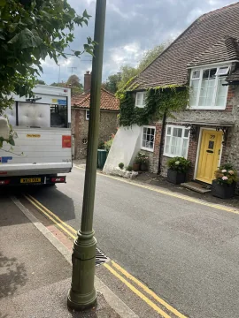 Removals van parked on a narrow street for a local move