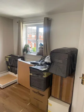 Furniture wrapped and protected in an empty room