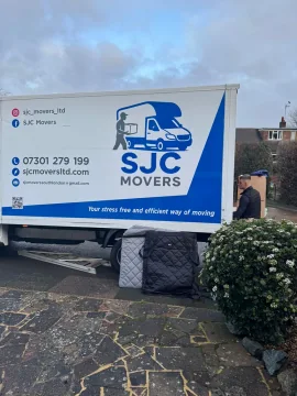 SJC Movers van signage showing contact details