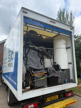 Removals van carefully loaded with blanket-wrapped furniture and bubble wrap
