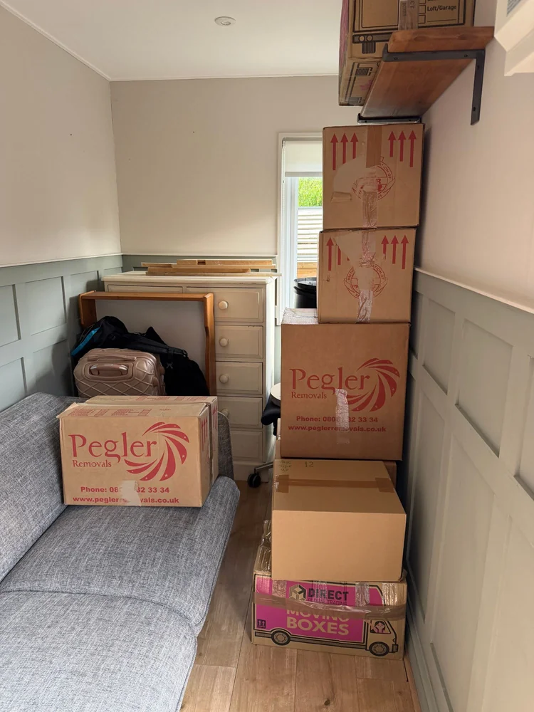 Belongings boxed and stacked ready to clear from a Sutton property
