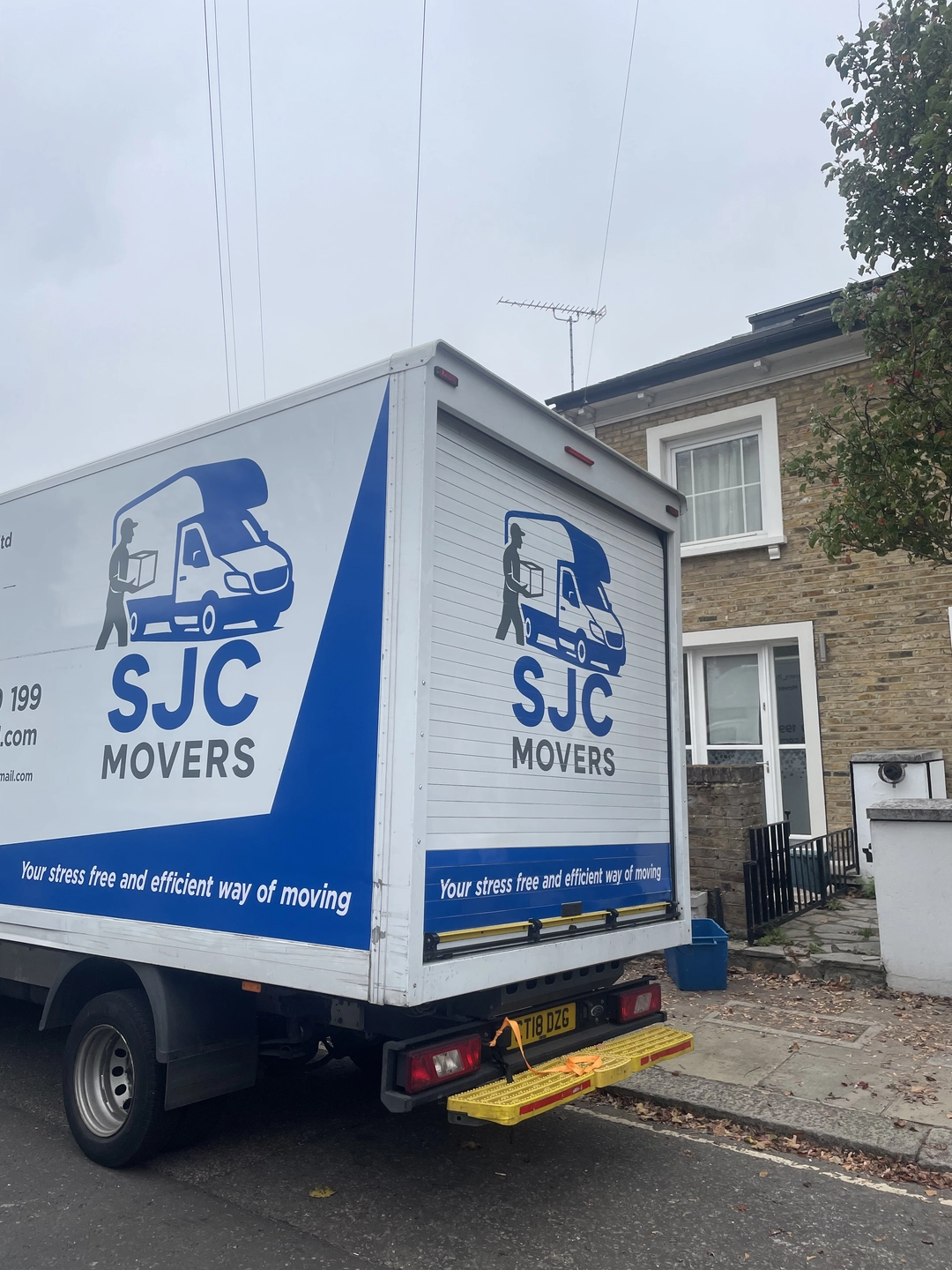 SJC Movers van on a Carshalton street